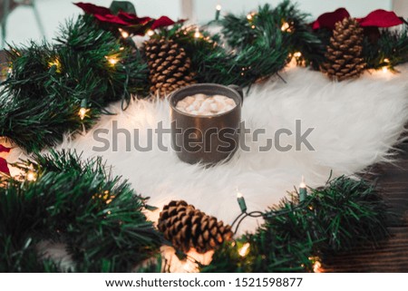Christmas hot cocoa on a fur blanket
