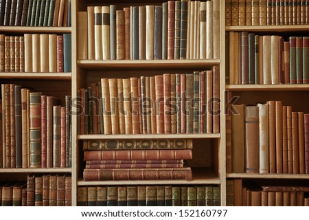 bookcase with many old books in a  library Royalty-Free Stock Photo #152160797