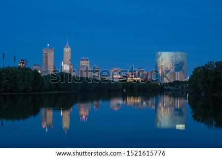 Indianapolis, Indiana skyline at night with the White River in the foreground
