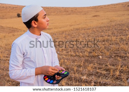 Muslim man painting the golden lovely scene