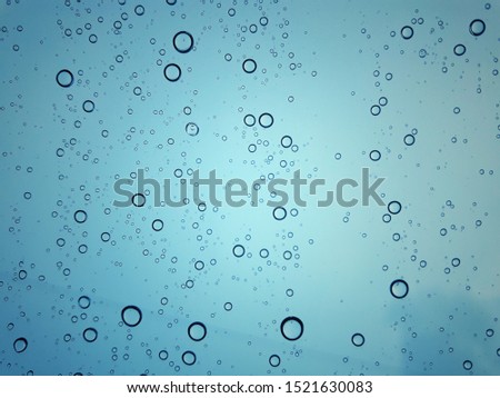 Beautiful raindrops in the rainy season on glass
