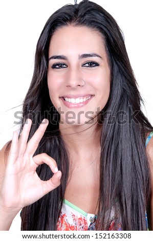woman smiling doing the okay sign over a white background 