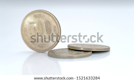 Closeup of Japanese yen money coins on isolated white background for financial concept