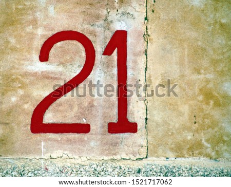 Number 21 , street number plate on a house.