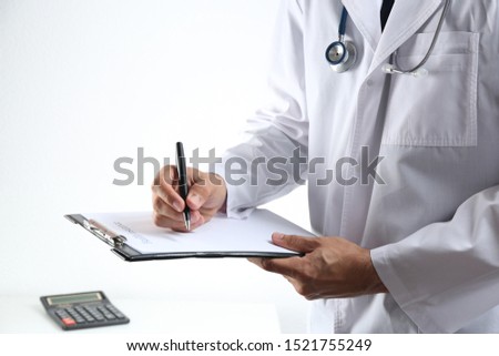 Doctor with medical insurance form indoors, closeup