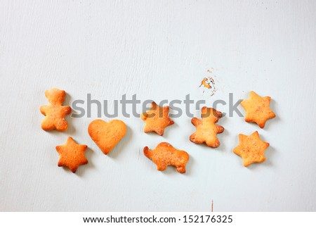 Gingerbread cookies over blue wooden background 
