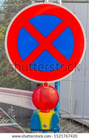 Traffic sign no stopping and lamp on a construction site