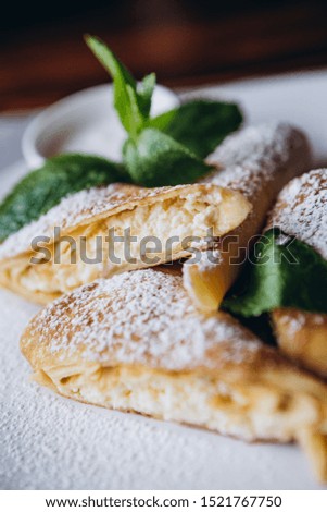 delicious and juicy Russian pancakes with stuffing and sauces served for serving at the restaurant for breakfast