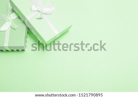 green gift box with ribbon. blank background