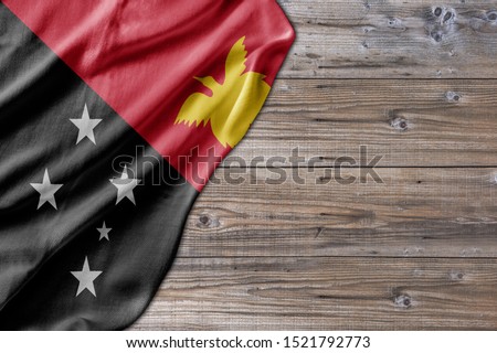 Wooden pattern old nature table board with Papua New Guinea flag