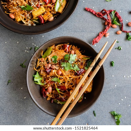 Delicious and spicy homemade meal / Stir Fried Sichuan Mala Noodle with Pork  / Pork slices, assortments of dried peppercorn, chili pepper to give the exclusive flavors and tongue numbing spiciness  