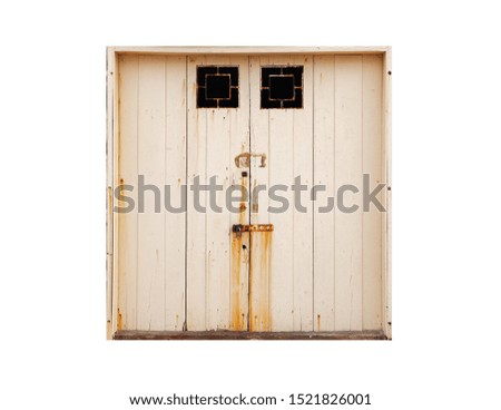 Closed old yellow hangar gate isolated on white background, photo texture, front view