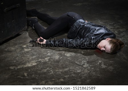 Crime scene imitation. Dead woman lying on a floor

