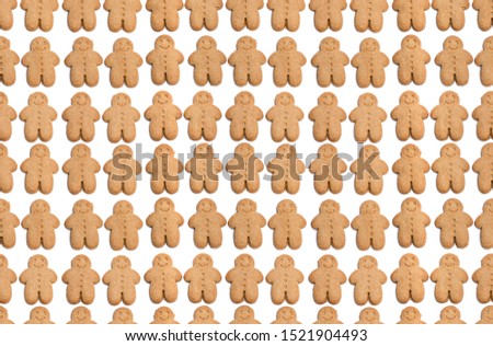 Seamless  Endless pattern of baked gingerbread man cookies isolated on white 