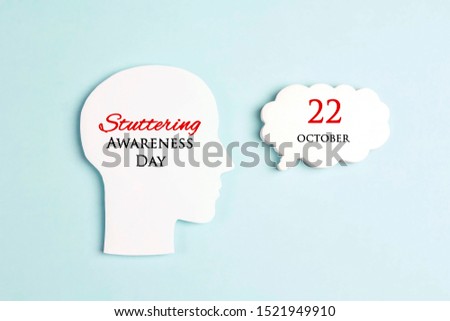 International Stuttering Awareness day, 22 October. Face profile silhouette with speech bubble on a blue background. Greeting message concept.