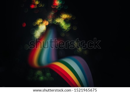 Beautiful abstract rainbow bridge and multi colored space background in the darkness.