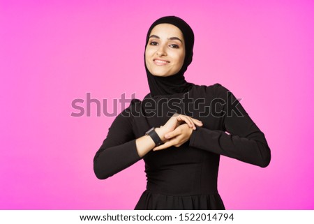 woman looking at the camera with a beautiful model smiling