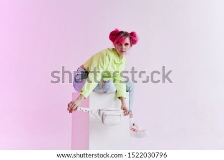 woman model in stylish bright clothes looking at the camera