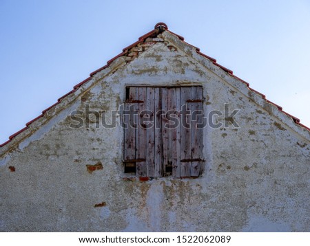 Old Shed with wooden door and blue sky background