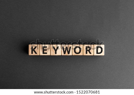 Keyword - word from wooden blocks with letters, search information that contains that word keyword concept, random letters around, white  background Royalty-Free Stock Photo #1522070681