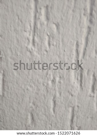 Wall with concrete rough texture white paint coating