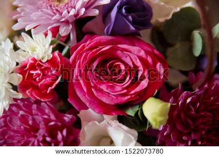 inside the bouquet of paper and white flowers .Beautiful wedding colorfull bouquet for bride. Beauty of colored flowers. Beautiful bunch of Gerbera flowers with white, red, pink and  flowers . 