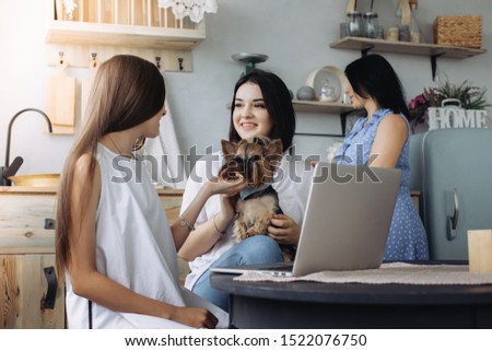 Mother with daughters in the kitchen 