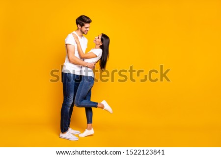 Full body photo of amazing pair slow dancing at prom night party looking eyes wear casual outfit isolated yellow color background