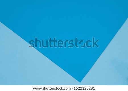 Color papers geometry flat composition background with blue tones. Paper background of blue and blue paper with triangle