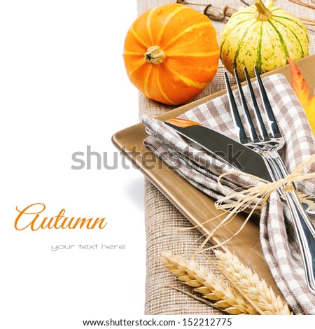 Autumn table setting with pumpkins isolated over white
