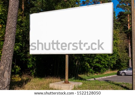 white Billboard, UPS, Mockup For your advertising near roads and forests Royalty-Free Stock Photo #1522128050