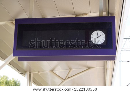 scoreboard at the station with a clock for the schedule, track and platform, as well as the departure time. waiting for the arrival or departure of trains, trains Royalty-Free Stock Photo #1522130558
