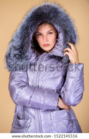 Look at this. woman in padded warm coat. flu and cold. seasonal fashion. girl in puffed coat. faux fur fashion. happy winter holidays. Christmas time. beauty in winter clothing. cold season shopping.