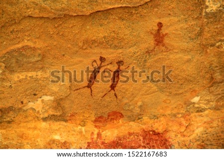 Rock painting in the region of "Serra da Capivara" - State of Piaui - Northeast Brazil. The picture seems to depict a couple going for a walk.