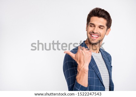 Close-up portrait of his he nice attractive lovely cheerful cheery glad businessman agent broker wearing checked blazer pointing thumb aside ad isolated over light white pastel background