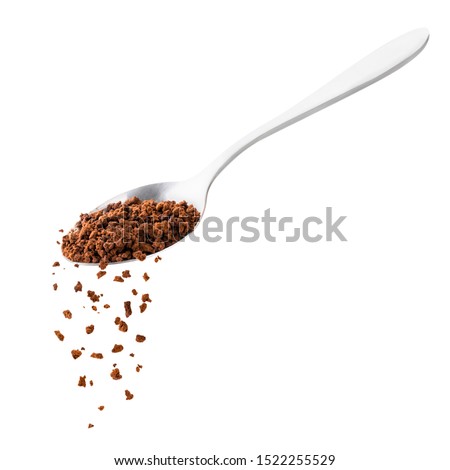 Instant coffee spills from a spoon on a white. Isolated Royalty-Free Stock Photo #1522255529