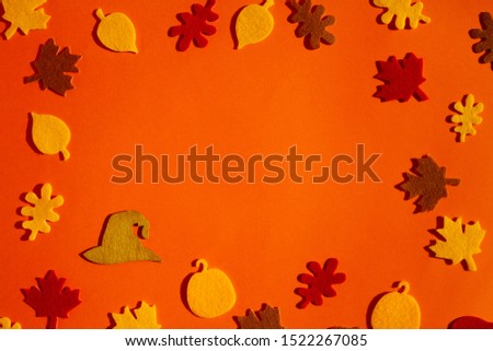 Beautiful bright orange background with carved leaves and a magician hat.
Beautiful blank for poster on Halloween.
