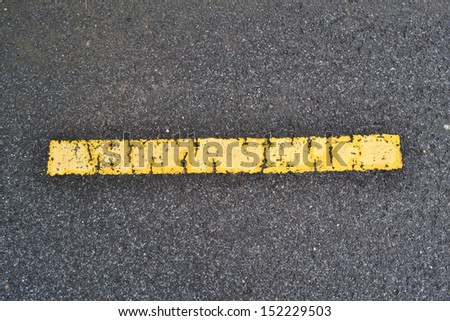 asphalt road texture with yellow stripe.
