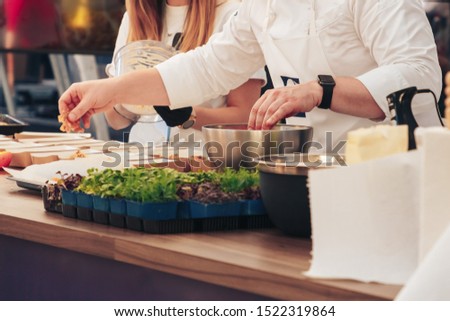 Swedish company chef prepares food at master class Royalty-Free Stock Photo #1522319864