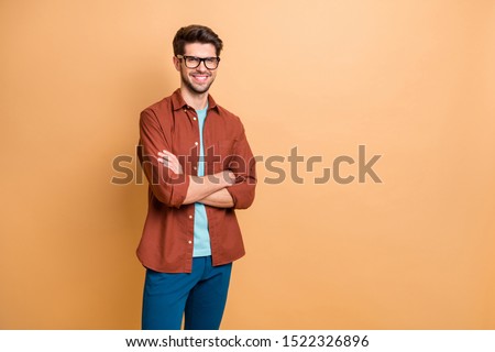 Portrait of his he nice attractive content successful cheerful cheery brown-haired guy professional finance expert shark folded arms isolated over beige color pastel background