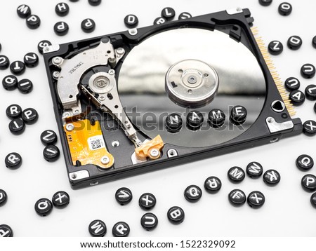 Dissembled hard disk drive and spread letters and gdpr compliant text law concept photo