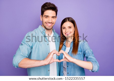 Forever together! Portrait of charming married spouses have honeymoon show sign of their felings heart make heart form fingers wear good-looking stylish outfit isolated over violet color background