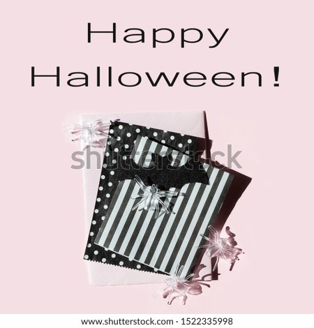 halloween flat lay, composition mockup of a ghost, spiders, pumpkins on a pink background, holiday background, postcard