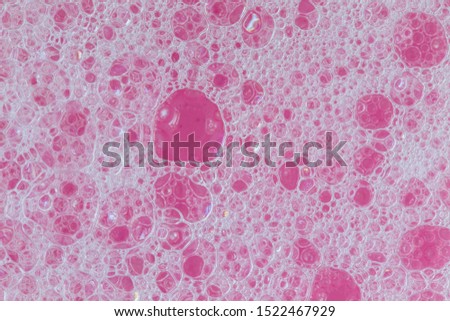 foam red texture soap bubbles on the water abstract background