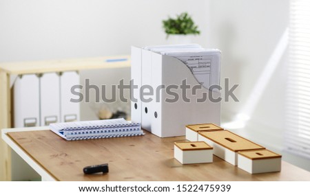 Comfortable working place in office with wooden table