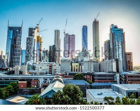 Modern and colourful city buildings with a clear sky at dawn.  Royalty-Free Stock Photo #1522500377
