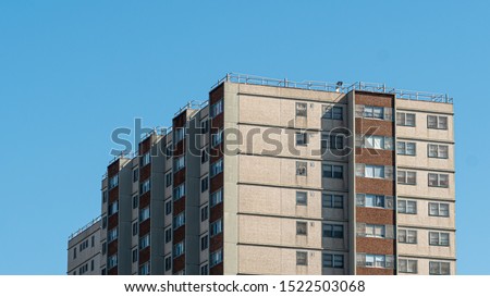Close up of a housing commission, or public housing, building in Melbourne, Australia. The government built this apartments to provide low income families with low rent housing. Royalty-Free Stock Photo #1522503068