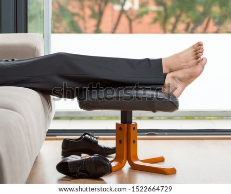 Businessman resting after work at home Royalty-Free Stock Photo #1522664729