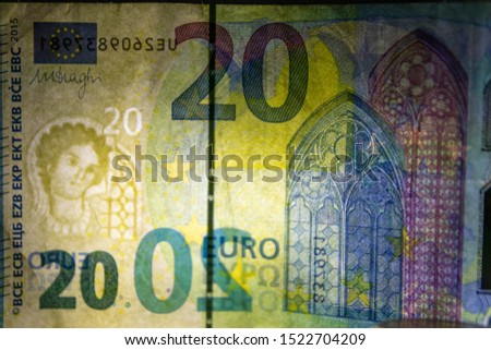 Macro of an european bank note in closeup with backlight showing its watermark as financial security feature for safety in financial payment in europe and cash money exchange
