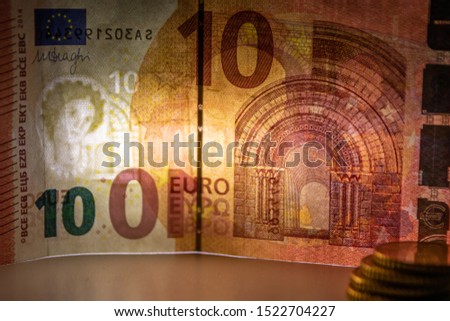 Macro of an european bank note in closeup with backlight showing its watermark as financial security feature for safety in financial payment in europe and cash money exchange